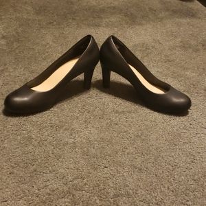 Black leather pumps